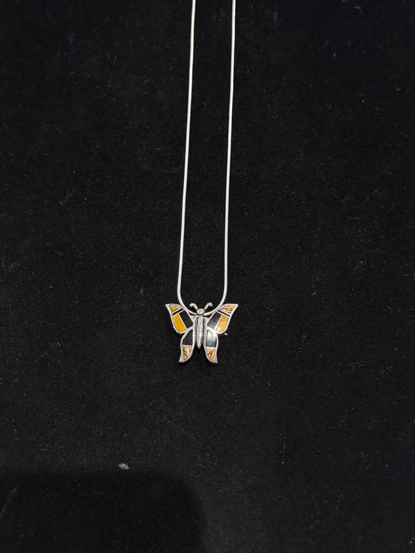 Butterfly pendent Native Earth.