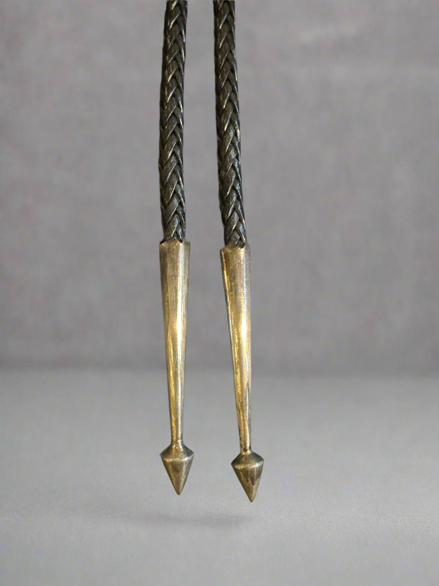 Bolo Tie with inlaid Turquoise in it made by super smith.