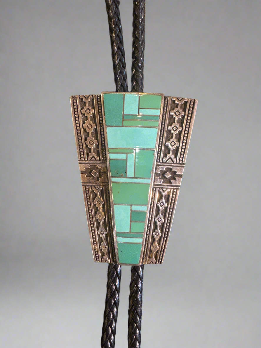 Bolo Tie with inlaid Turquoise in it made by super smith.