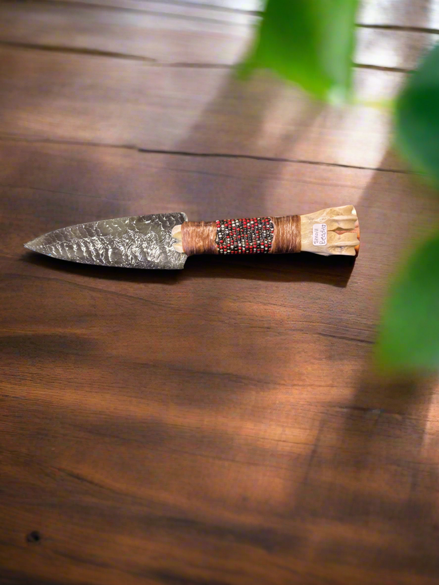 Small beaded bone obsidian knife.