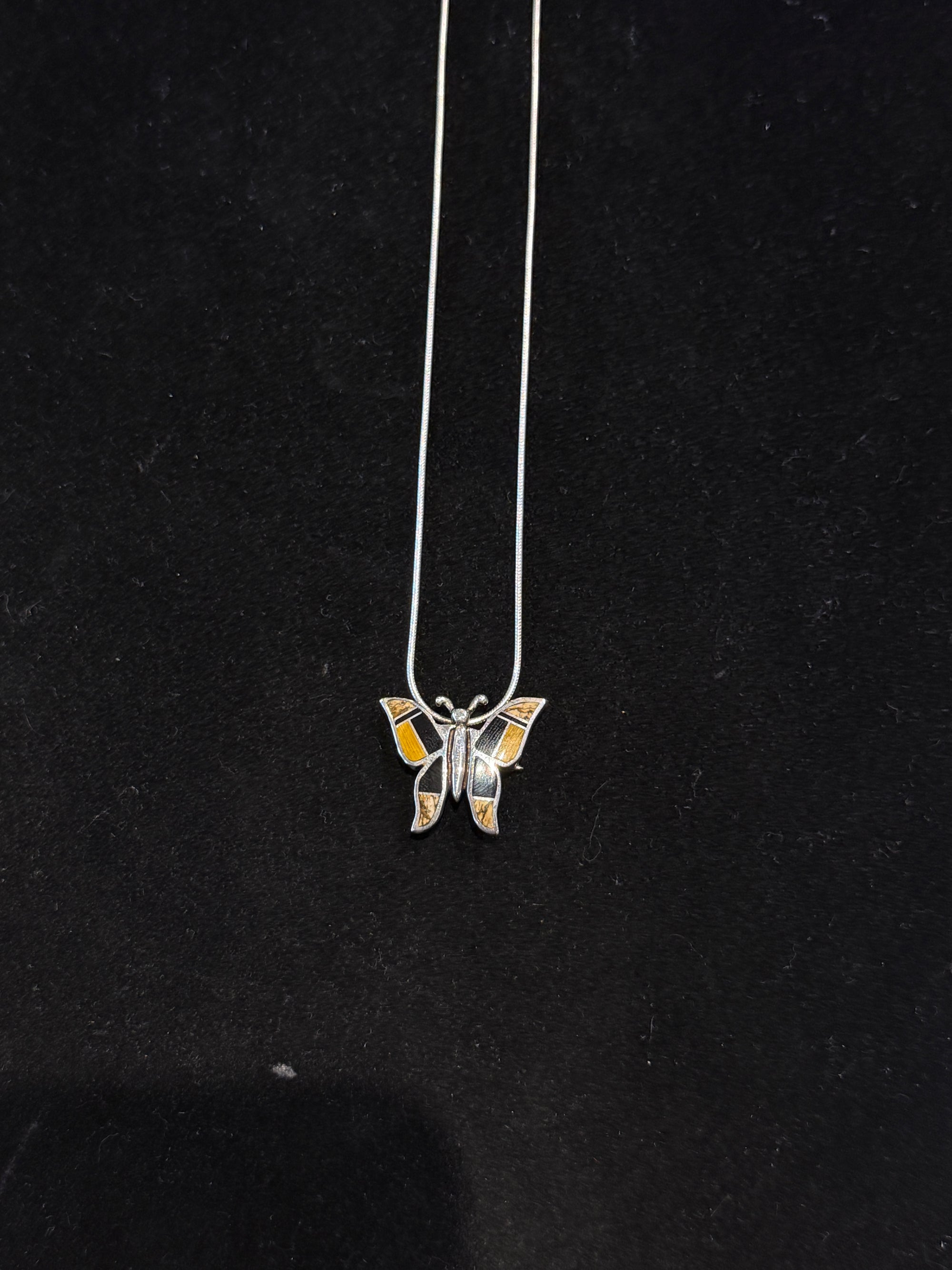 Butterfly pendent Native Earth.